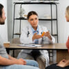 side view couple talking doctor 1