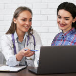 Doctor explaining injectable weight loss treatments and long-term weight management options to a patient