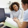 Patient reviewing hormone replacement therapy results with a provider during a follow-up consultation