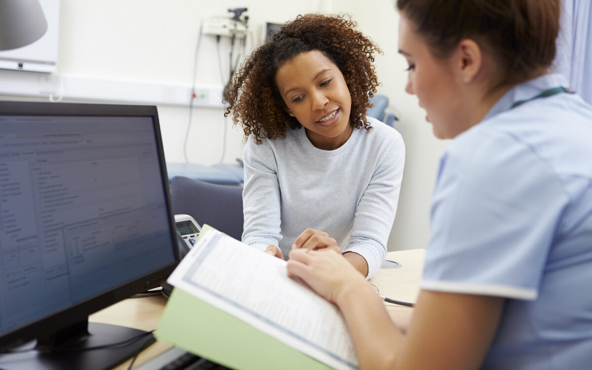 Patient reviewing hormone replacement therapy results with a provider during a follow-up consultation